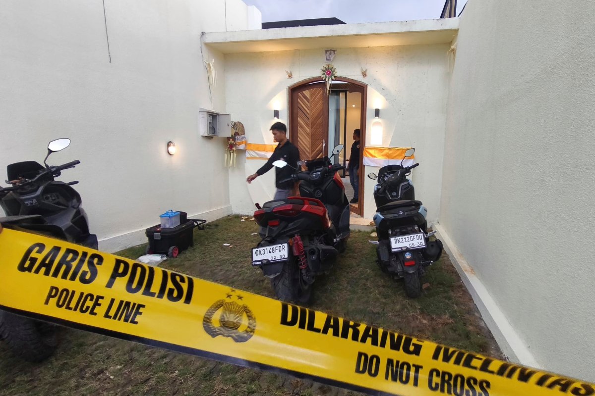 Plain-clothed police officers are seen at a villa where a shooting that led to the death of an Australian man reportedly occurred, in Badung on the resort island of Bali, Indonesia, Saturday, June 14, 2025.