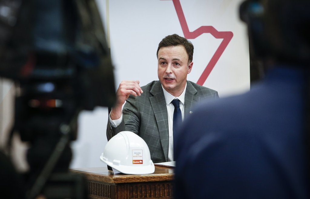 Manitoba Finance Minister Adrien Sala speaks to media at a press conference before the provincial budget is read at the Manitoba Legislature in Winnipeg, Thursday, March 20, 2025. THE CANADIAN PRESS/John Woods.